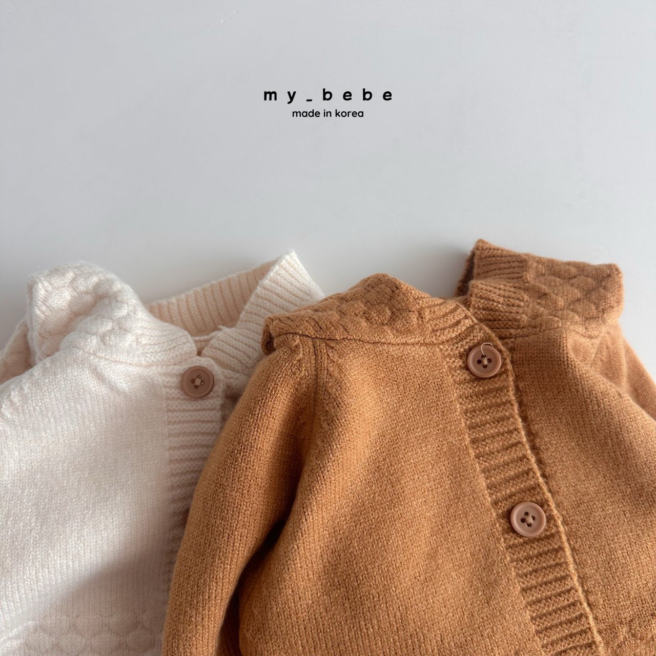 Pompom hooded knit onesie