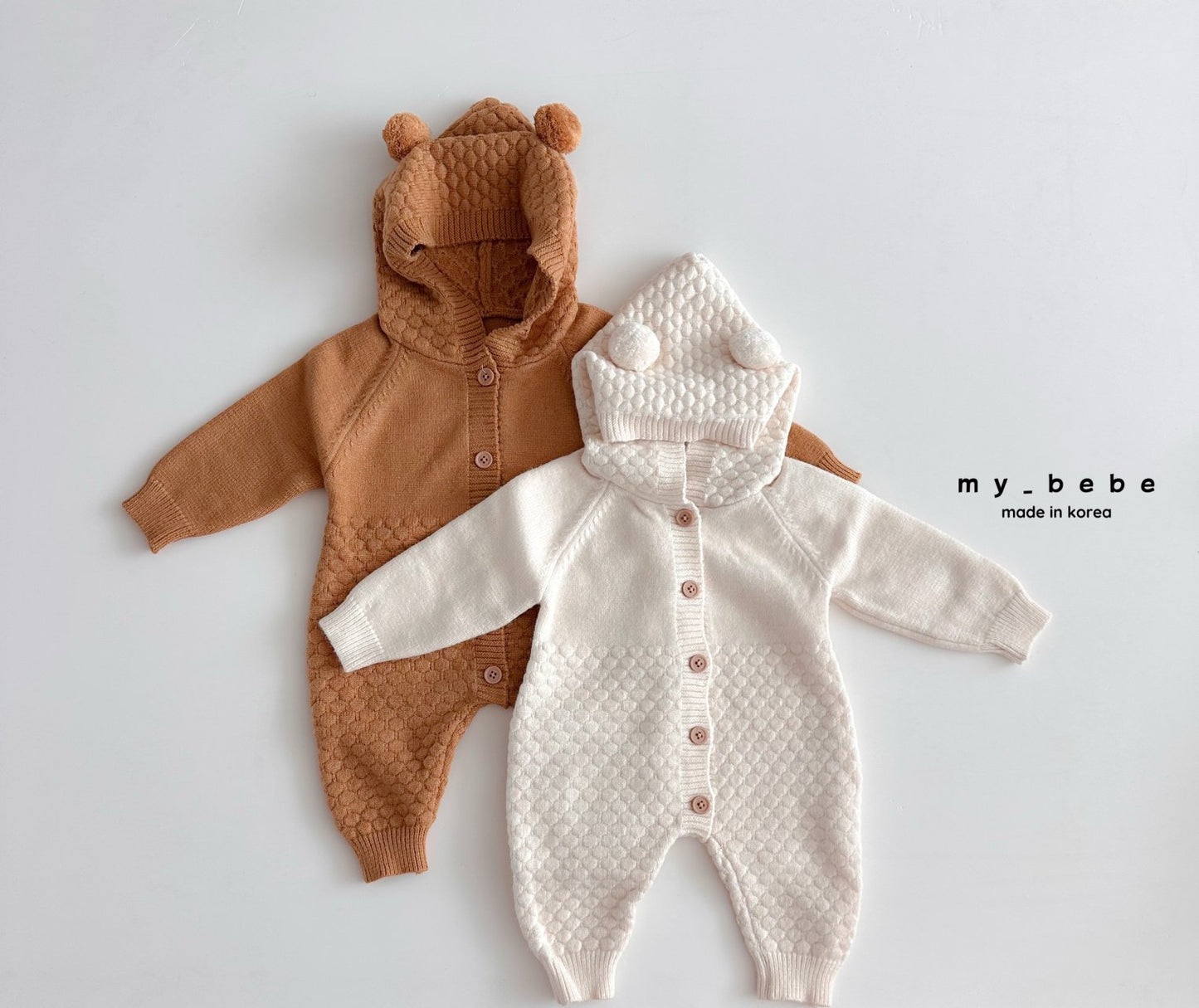 Pompom hooded knit onesie