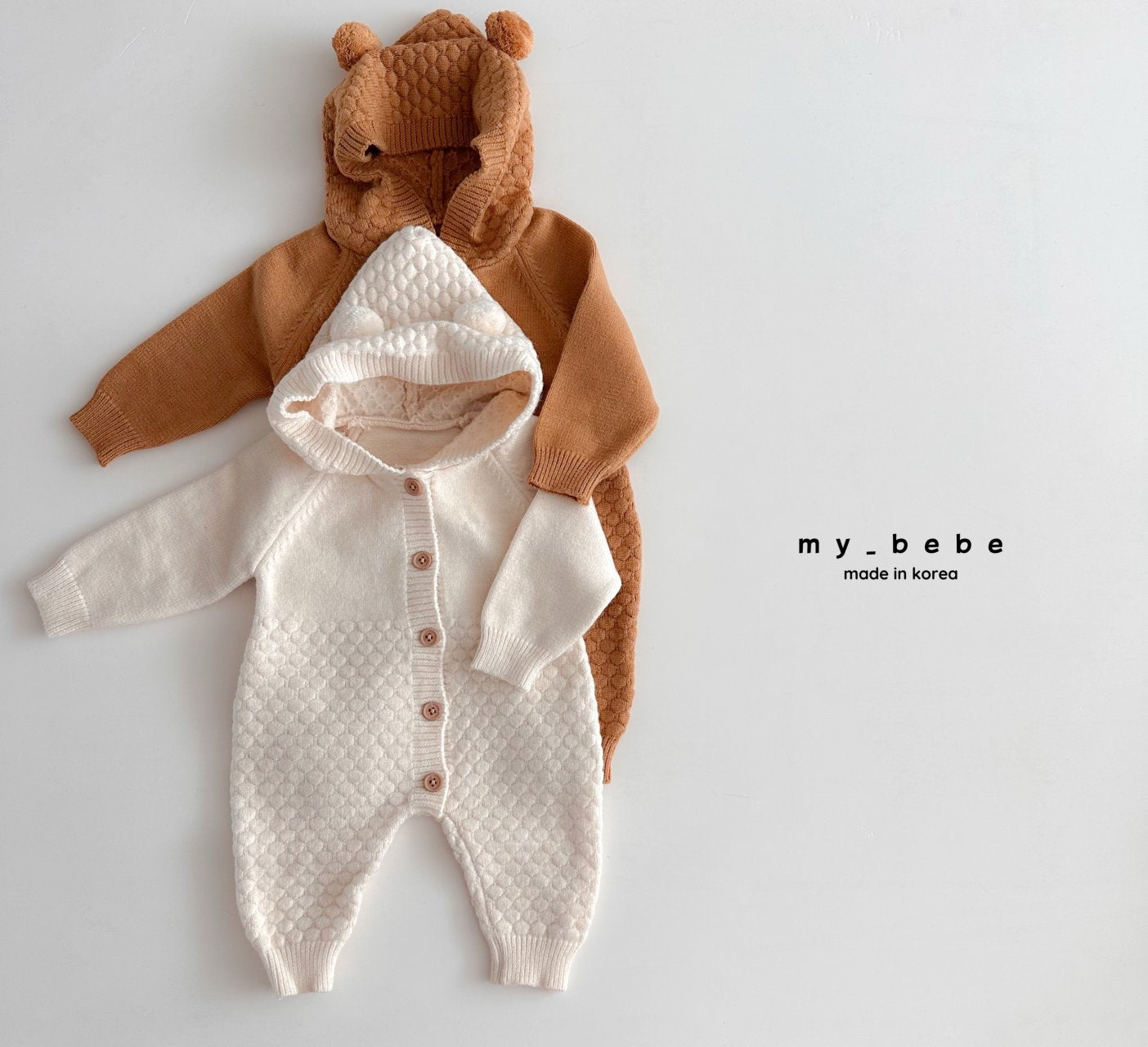 Pompom hooded knit onesie