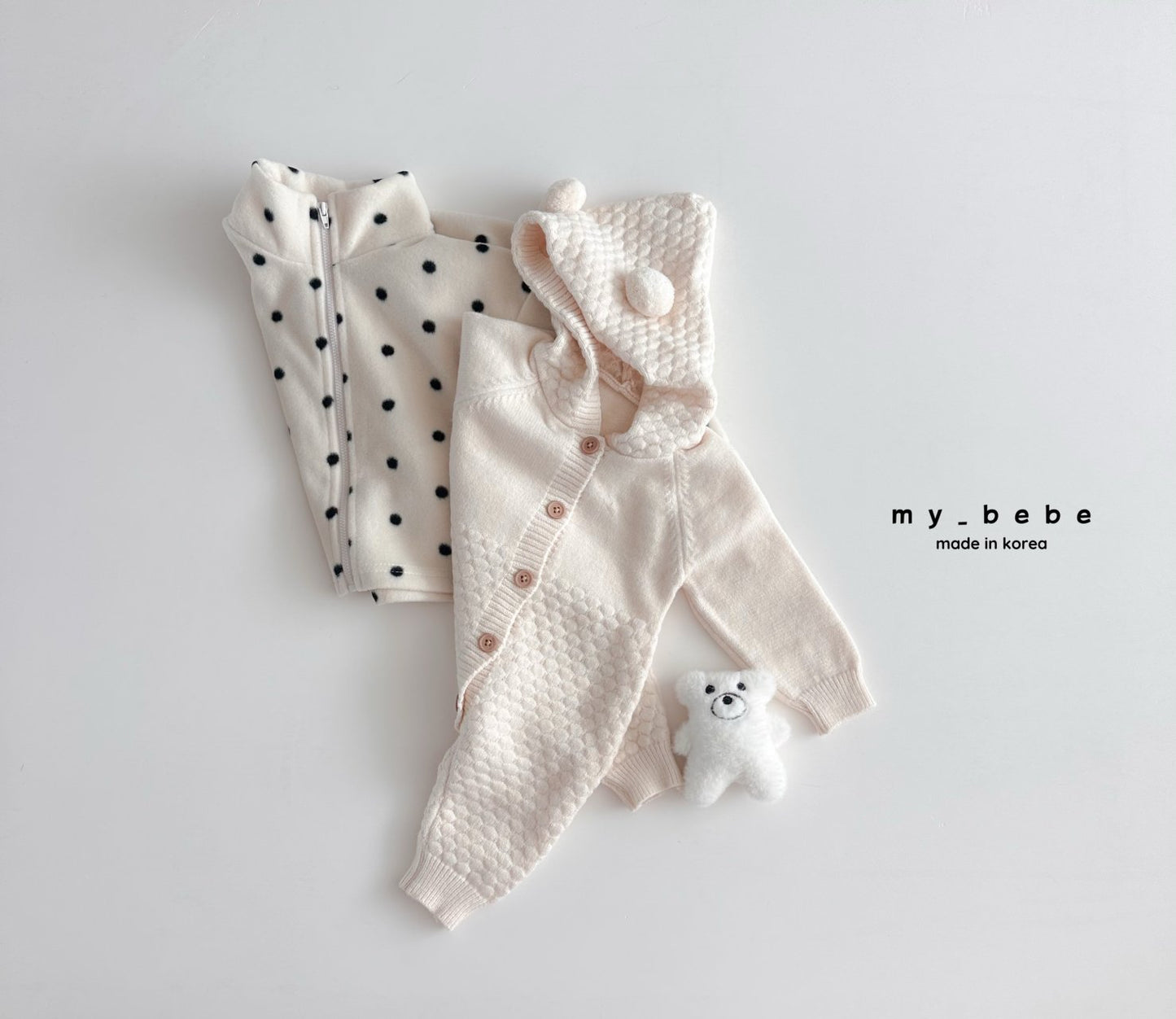 Pompom hooded knit onesie