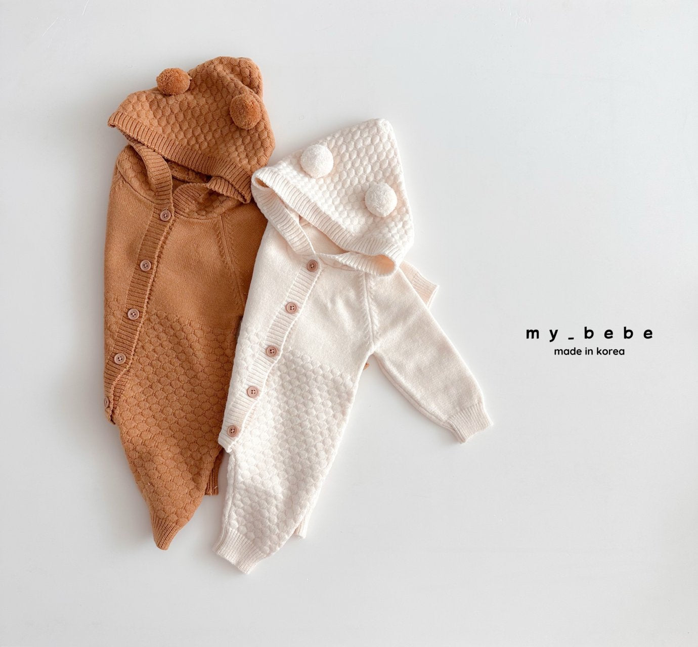 Pompom hooded knit onesie
