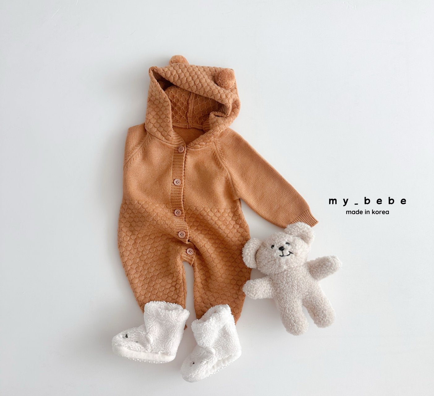 Pompom hooded knit onesie