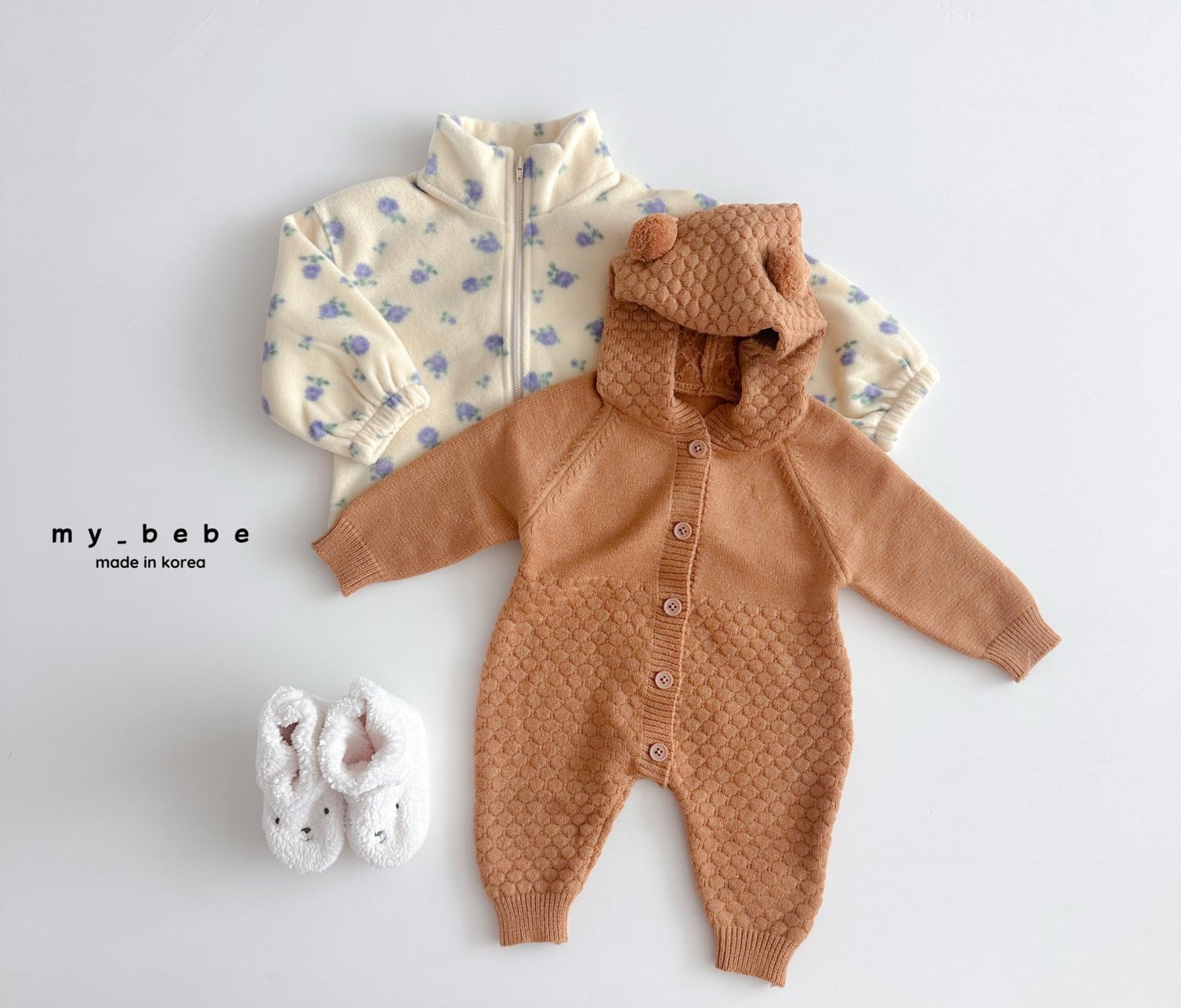 Pompom hooded knit onesie
