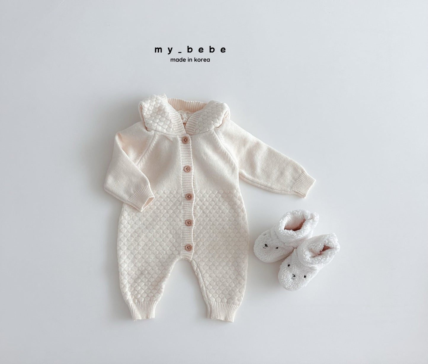 Pompom hooded knit onesie