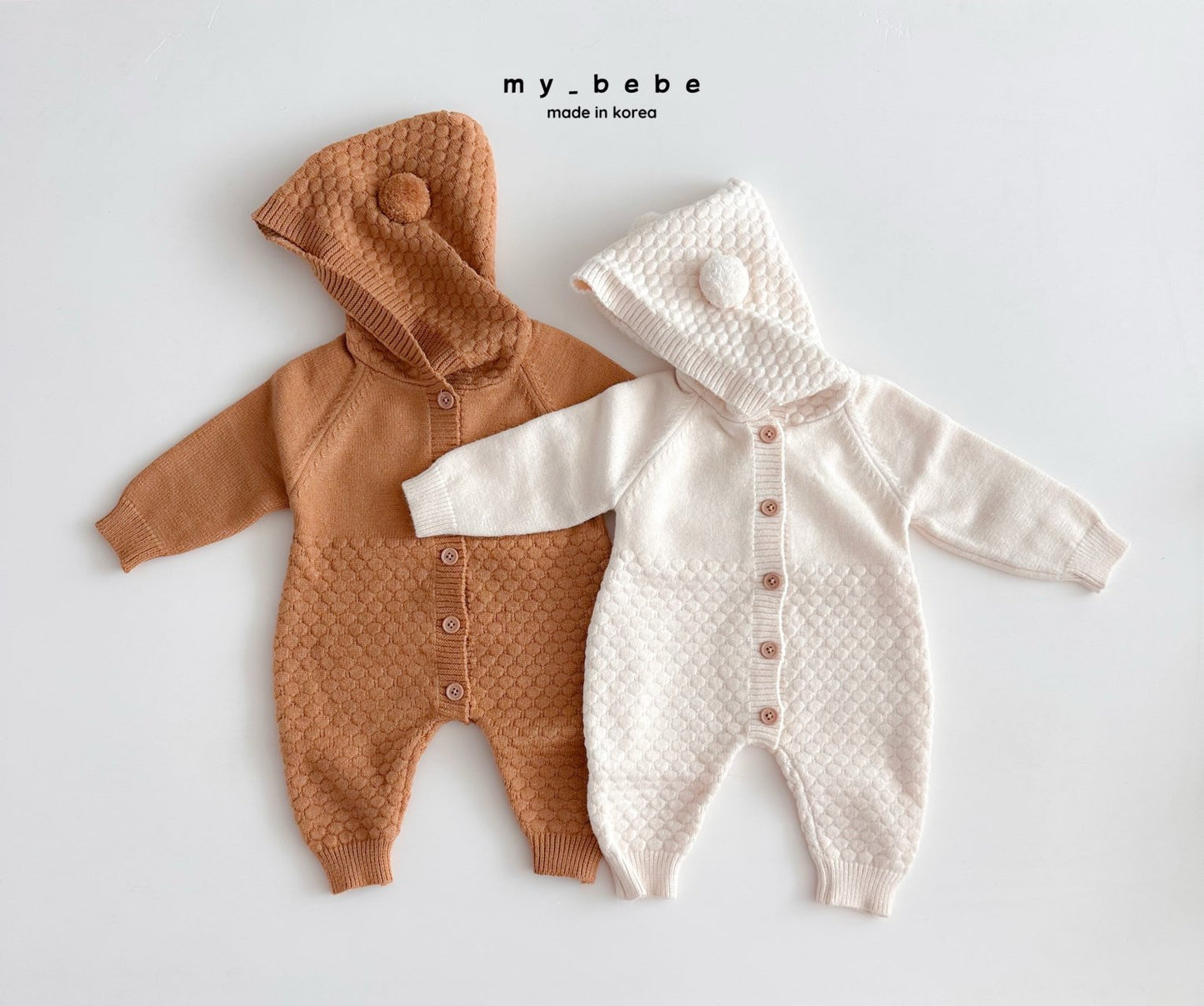 Pompom hooded knit onesie