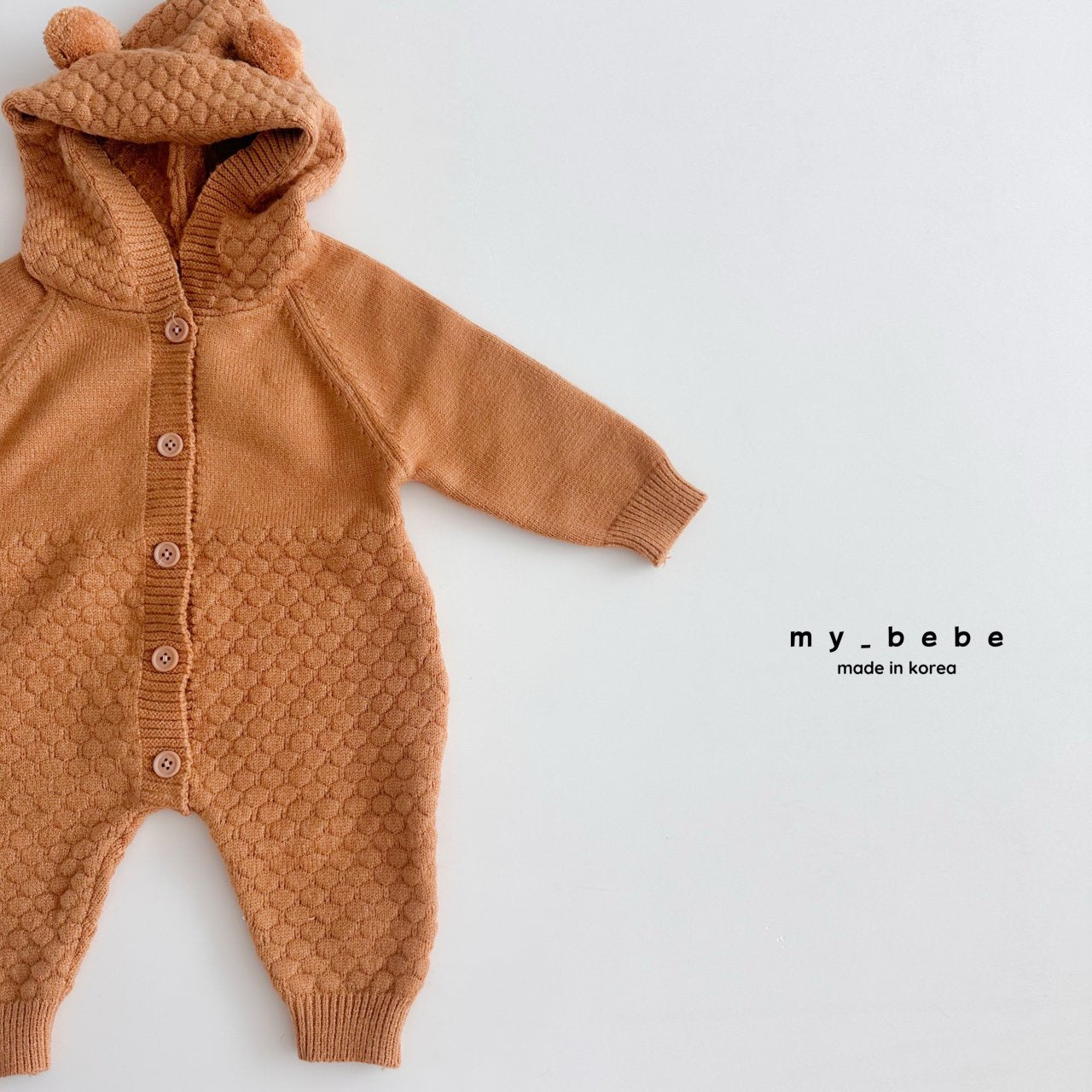 Pompom hooded knit onesie